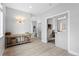 Bright hallway with console table, leading to an office with a glass door at 4589 Quandary Peak St, Brighton, CO 80601