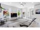Comfortable living room features large windows, stylish decor, and wall mounted TV at 4589 Quandary Peak St, Brighton, CO 80601