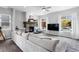 Bright living room featuring a modern fireplace, large windows, plush seating, and neutral tones at 4589 Quandary Peak St, Brighton, CO 80601