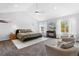 Spacious main bedroom with vaulted ceilings, ample natural light, and cozy seating area at 4589 Quandary Peak St, Brighton, CO 80601