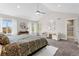 Bright main bedroom with ample natural light, neutral colors, and a cozy sitting area at 4589 Quandary Peak St, Brighton, CO 80601