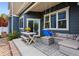 Inviting patio with seating, swing, and dining area, perfect for outdoor entertaining and relaxation at 4589 Quandary Peak St, Brighton, CO 80601