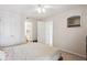 Bright bedroom with ensuite bath, ample closet space, neutral color palette, and ceiling fan at 1629 S Deframe St # B8, Lakewood, CO 80228