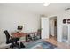 Bright bedroom with hardwood floors, featuring a desk and closet at 1629 S Deframe St # B8, Lakewood, CO 80228