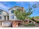 Charming condo with a two-car garage, featuring a well-maintained exterior and an inviting brick-accented entryway at 1629 S Deframe St # B8, Lakewood, CO 80228
