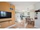 Bright kitchen featuring hardwood floors, light green cabinets, and modern stainless steel appliances at 1629 S Deframe St # B8, Lakewood, CO 80228