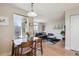 Bright living room featuring a dining area, comfortable gray sofa, and decor at 1629 S Deframe St # B8, Lakewood, CO 80228