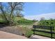 Scenic park view featuring a trail leading up a grassy hill and a comfortable bench for relaxation at 1629 S Deframe St # B8, Lakewood, CO 80228