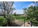 Landscaped yard offers a view to open space and a distant building at 1629 S Deframe St # B8, Lakewood, CO 80228