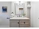 Bathroom vanity with gray cabinets, quartz countertop, stylish faucet, and modern decor at 2870 N Raleigh St, Denver, CO 80212