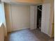 Finished basement space with carpet, closet, and a furnace closet at 15703 E 13Th Pl, Aurora, CO 80011