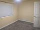 Bedroom featuring a window with blinds and neutral colored walls at 15703 E 13Th Pl, Aurora, CO 80011