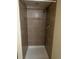 Tiled shower with neutral tones and a shower head at 15703 E 13Th Pl, Aurora, CO 80011