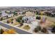 Picture of a home and long driveway in a well-maintained neighborhood with mature trees and landscaping at 6425 Tremolite Dr, Castle Rock, CO 80108