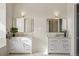 Bright bathroom featuring double sink vanity with modern fixtures and elegant design at 6425 Tremolite Dr, Castle Rock, CO 80108