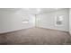 Spacious bedroom featuring plush carpeting and multiple windows for plenty of natural light at 6425 Tremolite Dr, Castle Rock, CO 80108