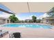 Large community pool with pergola, sunshades, and plenty of seating at 6425 Tremolite Dr, Castle Rock, CO 80108