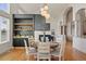 Dining room with adjacent bar, modern lighting and views at 6425 Tremolite Dr, Castle Rock, CO 80108