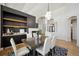 Elegant dining area with modern lighting and a sophisticated decor adjacent to the bar at 6425 Tremolite Dr, Castle Rock, CO 80108