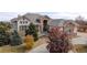 Stunning home showcasing stone accents, mature landscaping, and a circular driveway at 6425 Tremolite Dr, Castle Rock, CO 80108