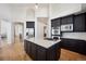 Contemporary kitchen featuring a center island, stainless appliances, and plenty of cabinetry at 6425 Tremolite Dr, Castle Rock, CO 80108