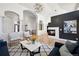 Elegant living room with hardwood floors, fireplace, and stylish decor at 6425 Tremolite Dr, Castle Rock, CO 80108
