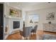 Inviting living room features a modern fireplace and bright natural light at 6425 Tremolite Dr, Castle Rock, CO 80108