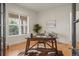 Office with a desk, large window, and hardwood floors at 6425 Tremolite Dr, Castle Rock, CO 80108