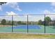 Active community tennis court with a well-maintained surface and beautiful landscaping and black fencing at 6425 Tremolite Dr, Castle Rock, CO 80108