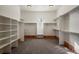 Large walk-in closet with built-in shelving and ample storage space at 6425 Tremolite Dr, Castle Rock, CO 80108