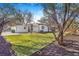 A well-maintained backyard with lush lawn and mature trees at 1240 S Chase Ct, Lakewood, CO 80232