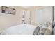 Tranquil bedroom boasting natural light and access to additional living space at 1240 S Chase Ct, Lakewood, CO 80232