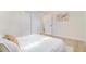 Cozy bedroom with plush bedding, neutral decor, and ample natural light at 1240 S Chase Ct, Lakewood, CO 80232