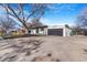 Charming single-story home boasts a well-maintained front yard and a spacious driveway at 1240 S Chase Ct, Lakewood, CO 80232