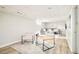 Finished basement featuring contemporary seating and living area with plush rug at 5885 S Huron St, Littleton, CO 80120