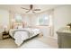Cozy bedroom with neutral tones, natural light, and comfortable decor, creating a relaxing atmosphere at 5885 S Huron St, Littleton, CO 80120