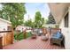 Relaxing deck area with outdoor seating, perfect for enjoying the lush backyard and sunny days at 5885 S Huron St, Littleton, CO 80120