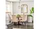Dining area adjacent to the kitchen with a round table and a chandelier at 5885 S Huron St, Littleton, CO 80120