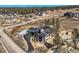 An aerial perspective featuring a contemporary residence, black driveway, and foundation at 5820 Powell Rd, Parker, CO 80134