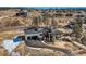 Aerial view of a contemporary home situated on a vast, picturesque landscape at 5820 Powell Rd, Parker, CO 80134