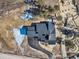 Birds-eye view of the property, displaying the roof layout and surrounding landscape at 5820 Powell Rd, Parker, CO 80134