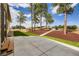 Inviting backyard with a concrete patio, new grass, and mulched area leading to blue Adirondack chairs at 5820 Powell Rd, Parker, CO 80134