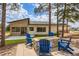 A backyard with a stone firepit area and comfortable seating at 5820 Powell Rd, Parker, CO 80134