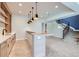 Basement bar area with custom cabinetry and a modern countertop at 5820 Powell Rd, Parker, CO 80134