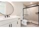 Contemporary basement bathroom with white vanity and a large mirror at 5820 Powell Rd, Parker, CO 80134