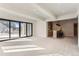 Finished basement with wet bar and sliding glass doors leading outside at 5820 Powell Rd, Parker, CO 80134
