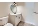 Modern half-bath with updated vanity and fixtures at 5820 Powell Rd, Parker, CO 80134
