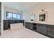 Modern bathroom with double vanity sinks and a large soaking tub at 5820 Powell Rd, Parker, CO 80134