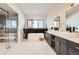 Spa-like bathroom with double sinks, soaking tub, and a walk-in shower at 5820 Powell Rd, Parker, CO 80134