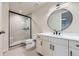 This bathroom offers black hardware, a vanity with drawers, and walk-in glass shower at 5820 Powell Rd, Parker, CO 80134